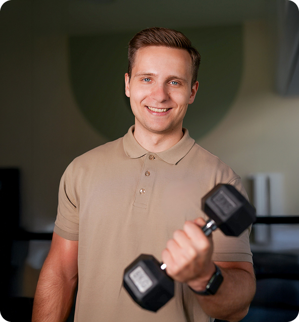 Trainer Bartek Malec with a dumbbell